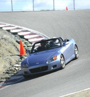 Through the turn 8A apex, exiting the Corkscrew at Laguna Seca